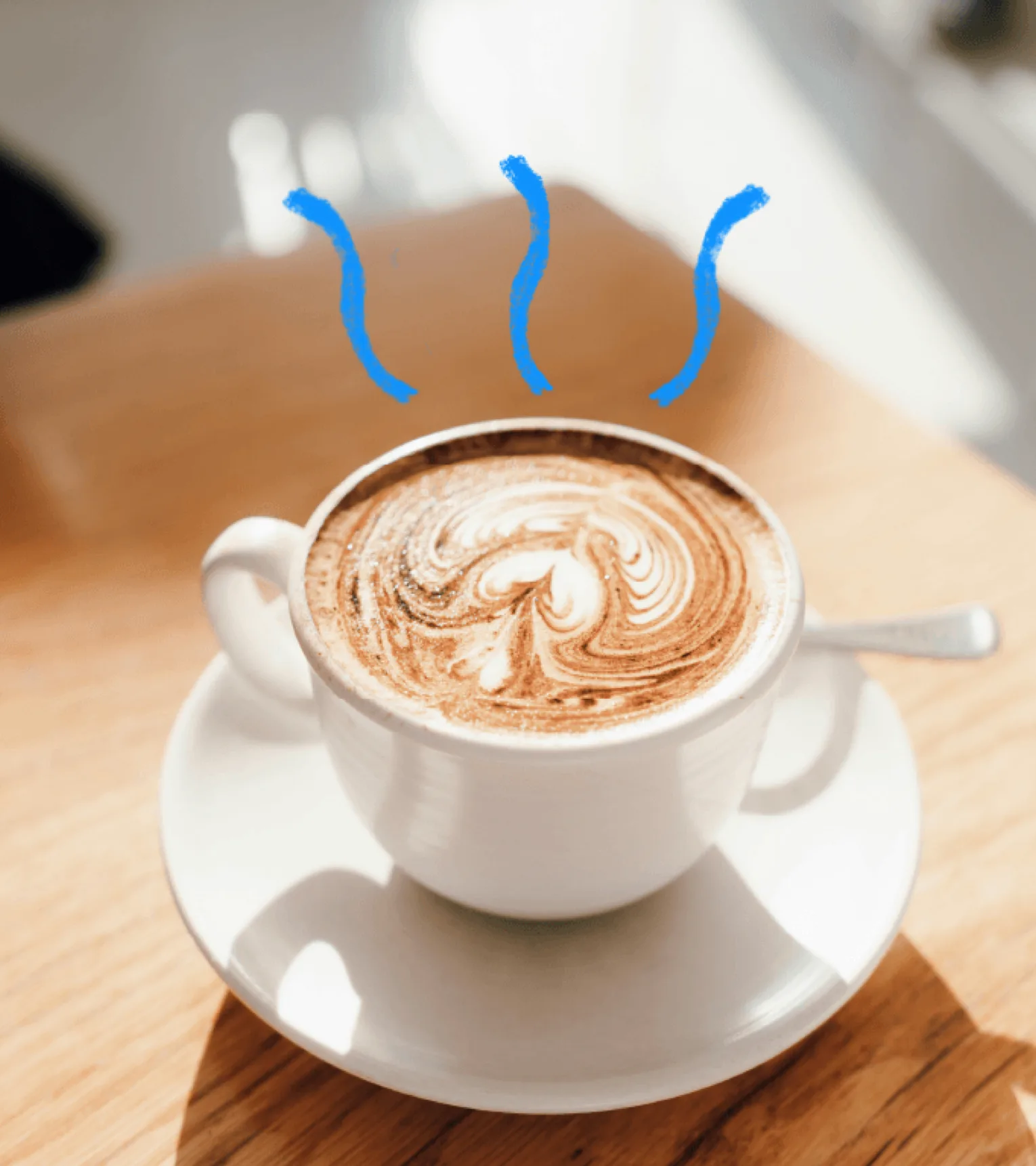 Latte art in a white cup with hand-drawn blue steam lines